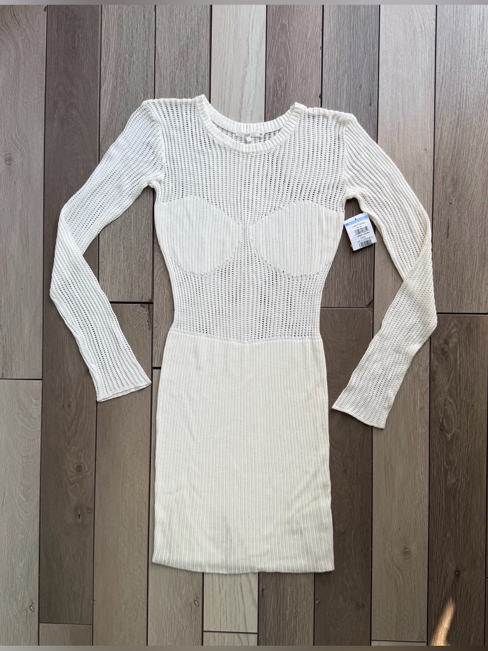 NIA "Anja" mini dress featuring an ivory ribbed pointelle knit design